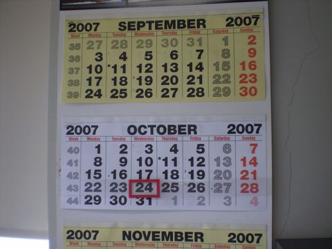 Wall calendar showing September and October with week numbers and one date circled in red