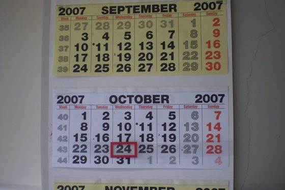 Wall calendar showing September and October with week numbers and one date circled in red